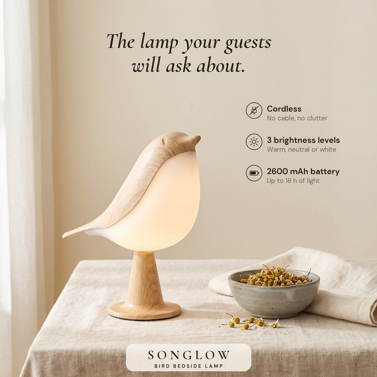 Songlow bird lamp on a linen-covered table with its key features: cordless, 3 brightness levels, 2600 mAh battery